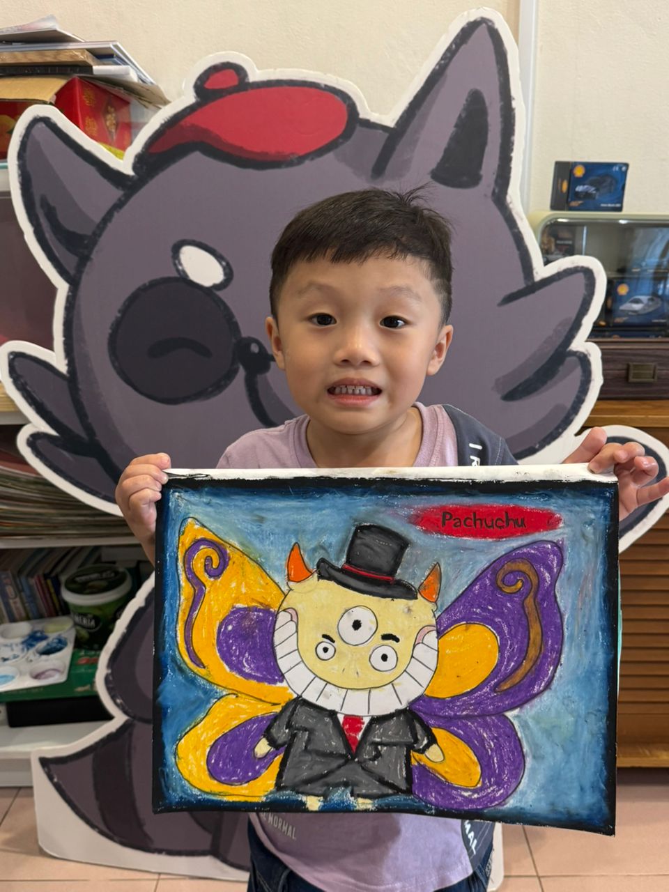 Student with butterfly art piece