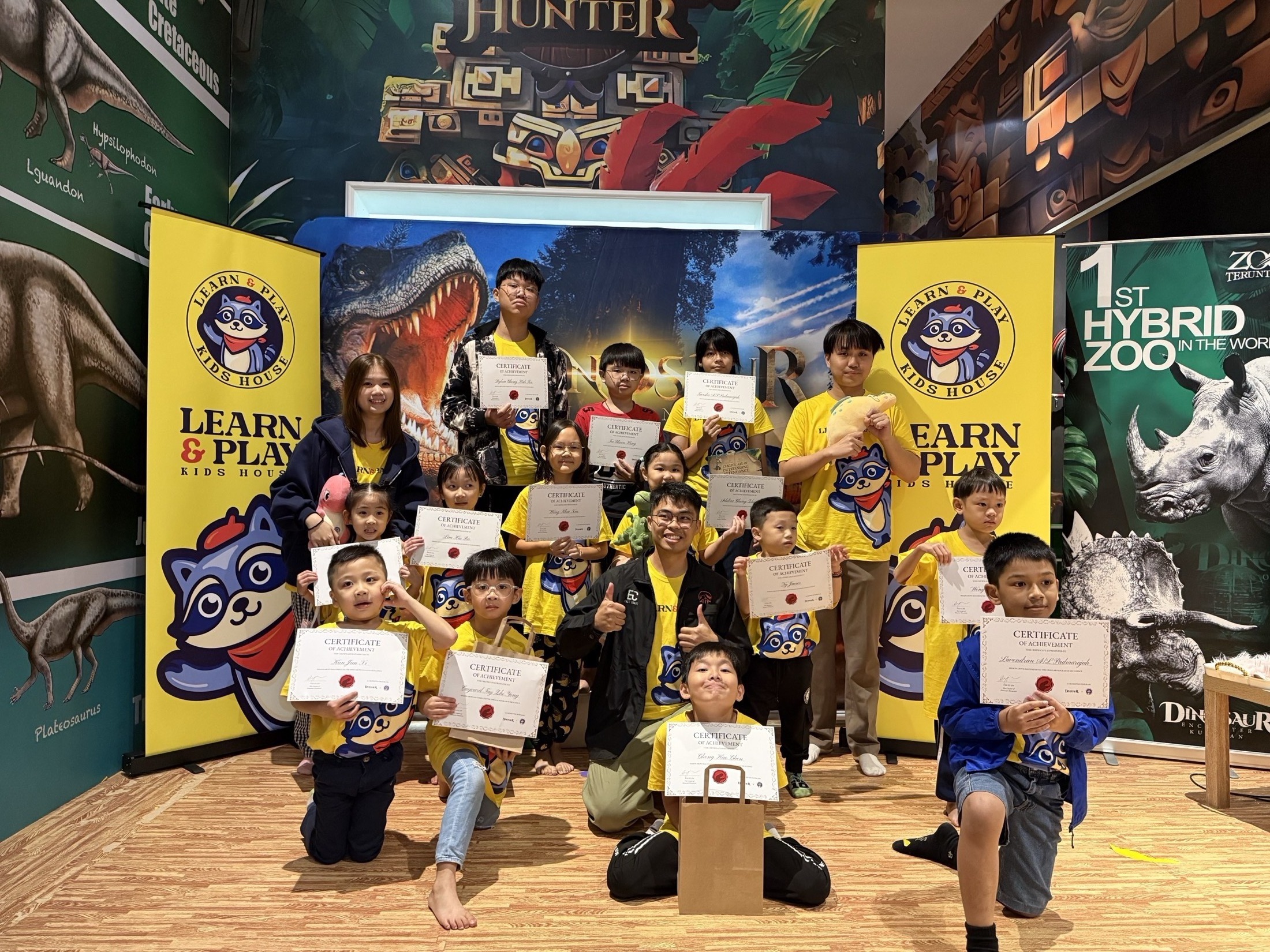 Children receiving certificates in Dino Lab Academy